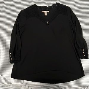 Black blouse. Lace detailing in the front. 3/4 length sleeves